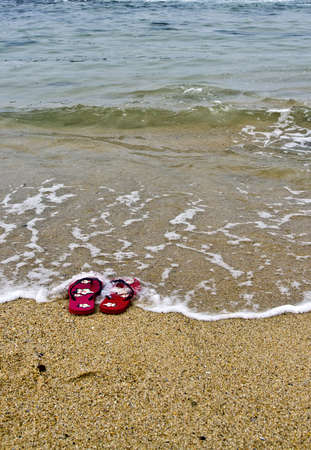 Flipflops in water with amazing colors and great lightの写真素材