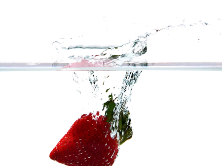Strawberry splash in white backgroundの写真素材
