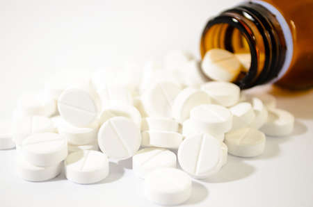 Pills Spilling out of Pill Bottle Shallow DOFの写真素材
