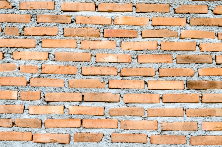 Weathered stained old brick wall backgroundの写真素材