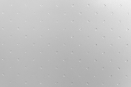 metal plate with many small circular holesの写真素材