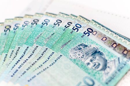 Business and finance composition. Account book
 with Malaysia Ringgitの写真素材