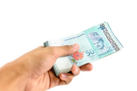 An Asian man counting some cash (select focus)