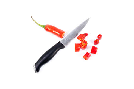 Red hot slice chili pepper isolated on white with stainless knife cut them の写真素材