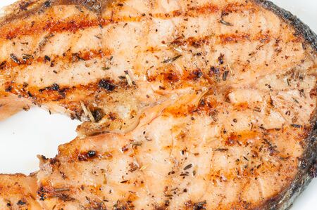Close Up of Grilled Salmon Steak with Boiled Vegetables Isolated on a White Backgroundの写真素材