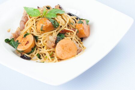 Spaghetti with Sausage Isolated on White Backgroundの写真素材