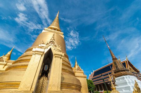 Front of Gold Pagoda in Wat Phra Kaew, Temple of the Emerald Buddha with blue sky Bangkok,Thailandの写真素材