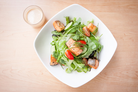 Salmon salad with cream on table - soft focus pointの写真素材