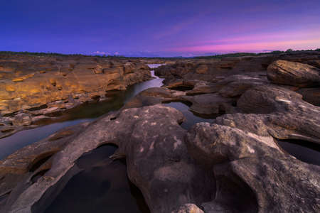 View beautiful sunset in mekong river (Sam Pan Bok grand canyon) ubon ratchathani province asia thailandの写真素材