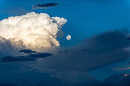 Moon and cloud blue sky in eveningの写真素材