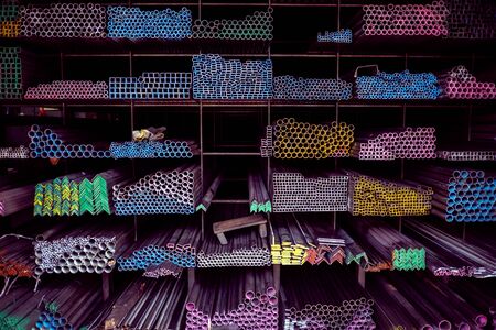 Stock warehouse many kind of steel tube, carbon steel, pipes round steel. Virous types of steel are new to work construction, industrial, manufacturing and building systems.の写真素材