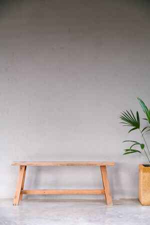 grey concrete wall wooden modern chair