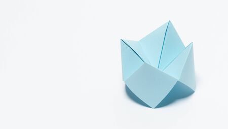 Paper fortune teller on white background