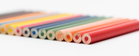 Multi color pencils on white background. The concept of a multinational family and equality in the world.の写真素材