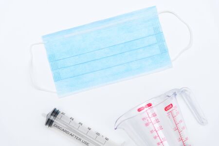 Blue medical disposable face mask with vaccine injection for protection against flu and other...