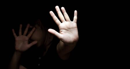 International Human Right day Concept: Women with her hand extended signaling to stop useful to...