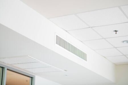 modern office interior with air conditioner on the wallの写真素材