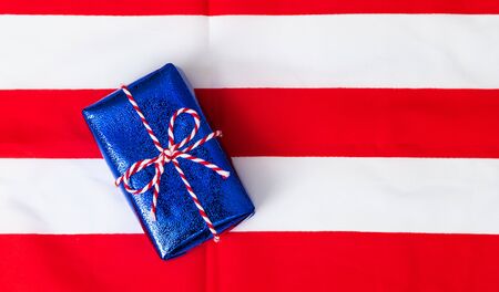 4th of July American Happy Independence Day card with gift boxes in national colors american flag on white background, Flat lay, top view, copy space, bannerの写真素材