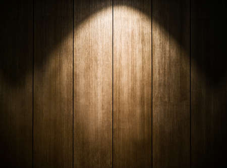 Wood wallpaper in dark room with light background.の写真素材