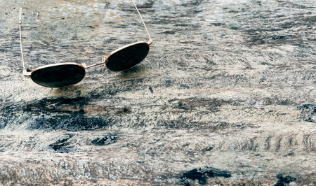 Sunglasses on wooden table summer concept