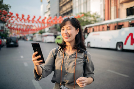Young Asian woman backpack traveler enjoying China town in Bangkok, Thailand.の写真素材