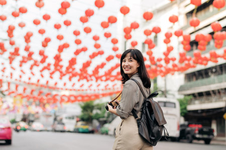 Young Asian woman backpack traveler enjoying China town in Bangkok, Thailand.の写真素材
