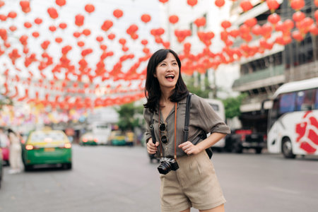 Young Asian woman backpack traveler enjoying China town in Bangkok, Thailand.の写真素材