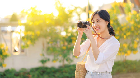 Asian woman traveler using camera. Asia summer tourism concept