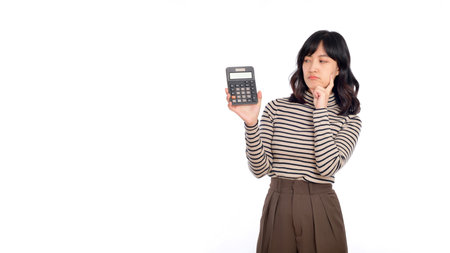 Young Asian woman casual uniform holding calculator. Business and financial concept.