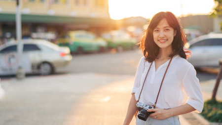 Asian woman traveler using camera. Asia summer tourism concept