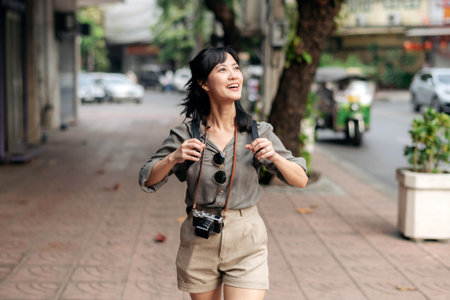 Young Asian woman backpack traveler enjoying street cultural local place and smile.の写真素材