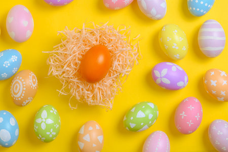 Happy easter celebration holiday. colourful pastel painted eggs in wicker basket nest decoration on...