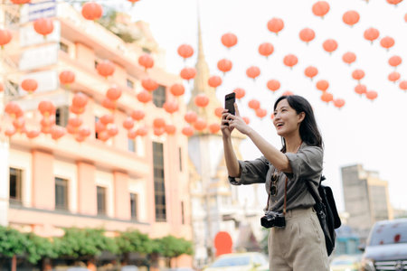 Young Asian woman backpack traveler enjoying China town in Bangkok, Thailand. Journey trip lifestyle, world travel explorer.の写真素材
