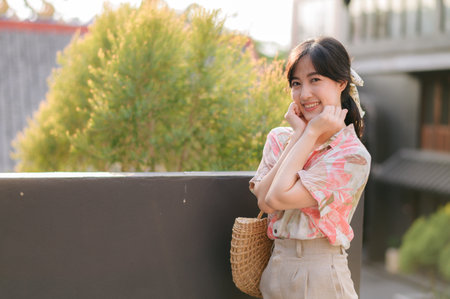 Portrait beautiful asian young woman on summer holiday vacation trip in Thailand. Young hipster female tourist sightseeing summer urban Bangkok destination. Asia summer tourism concept.の写真素材