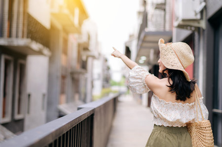 Happy asian youth woman with camera travels street city trip on leisure weekend. Young hipster female tourist sightseeing summer urban Bangkok destination. Asia summer tourism concept.の写真素材