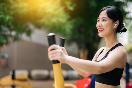 Young asian athletic sportswoman wearing sportswear listening relaxing music while working out...