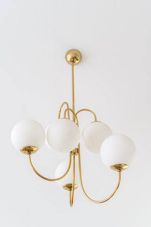 Add a touch of sophistication to your decor with a vintage-inspired hanging lamp, combining retro charm with contemporary elegance.の写真素材