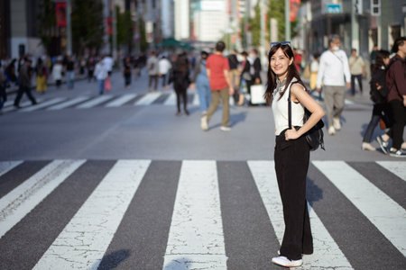 Dynamic crossing, Unseen faces on the move in Tokyo, testament to the bustling energy of the city.