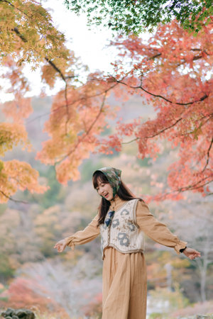 Asian woman casual dress enjoys Japan's beauty, walking amid vibrant