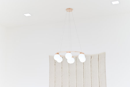 white modern round chandelier on white ceiling