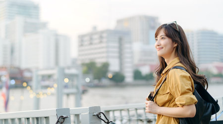young Asian woman in her 30s on a solo adventure. captures the essence of cultural exploration and joyful discovery.の写真素材