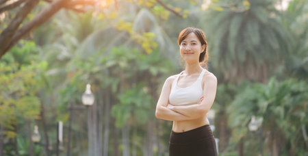 sportswoman with white sportswear in public park.の写真素材