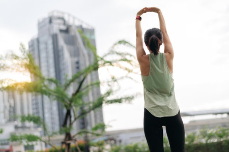 Calm asian woman in 30s fitness yoga workout. Stretching exercise reduces medical injury risk...