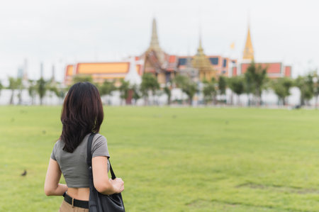 A solo southeast asian woman and teenage blogger enjoys world travel and tourism journey. local cultural experience for an asia explorer in bangkok thailand. travel tourism conceptの写真素材