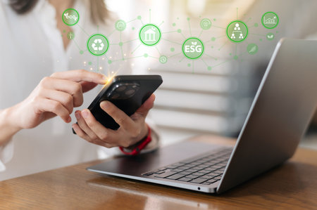 Empowered woman entrepreneur achieves sustainable green business goal integrating ESG concept environment social governance icon through digital technologyの写真素材