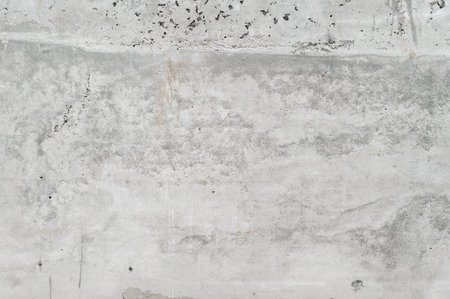 Gray concrete wall texture provides cool industrial background. perfect blank canvas surface for modern house renovation project creating simple yet strong aestheticの写真素材