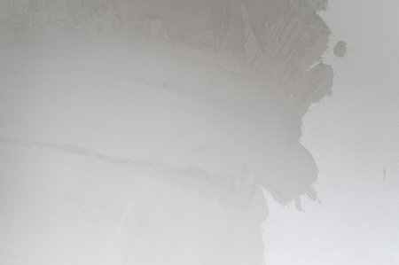 Stressful ceiling water damage shows peeling cracked paint from leak. old house structure needs urgent renovation and home improvement to fix damp plaster wallの写真素材