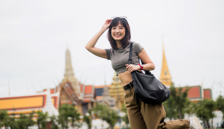 Happy solo southeast asian woman and teenager blogger enjoying world travel tourism concept. local cultural experience for an explorer in Bangkok Asia tourism in Thailandの写真素材