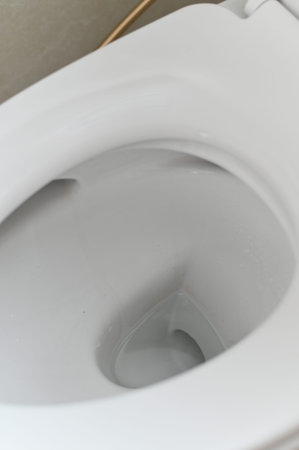 White toilet bowl clean ceramic surface modern bathroom fixture close up hygiene minimalist style...