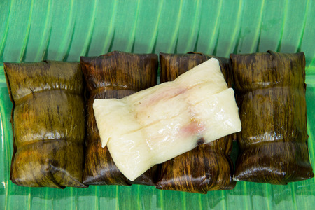 Thai dessert made from banana and glutinous rice, wrap with banana leaf (Khao Tom Mat or Khao Tom Pad)の写真素材